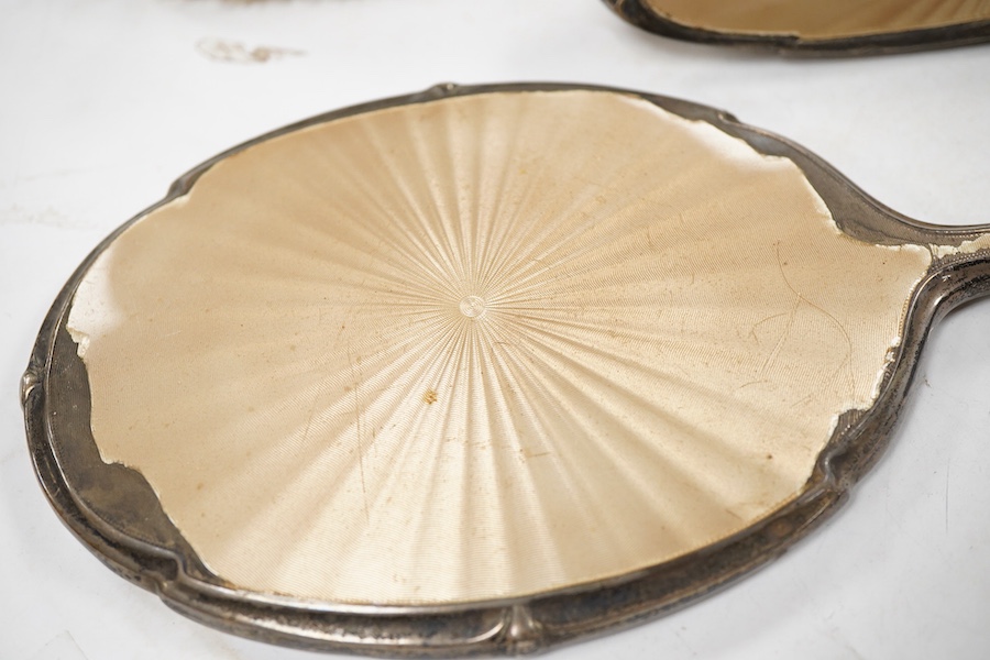 A George V silver and enamel five piece dressing table set (a.f.), together with four Victorian engraved silver topped glass toilet bottles